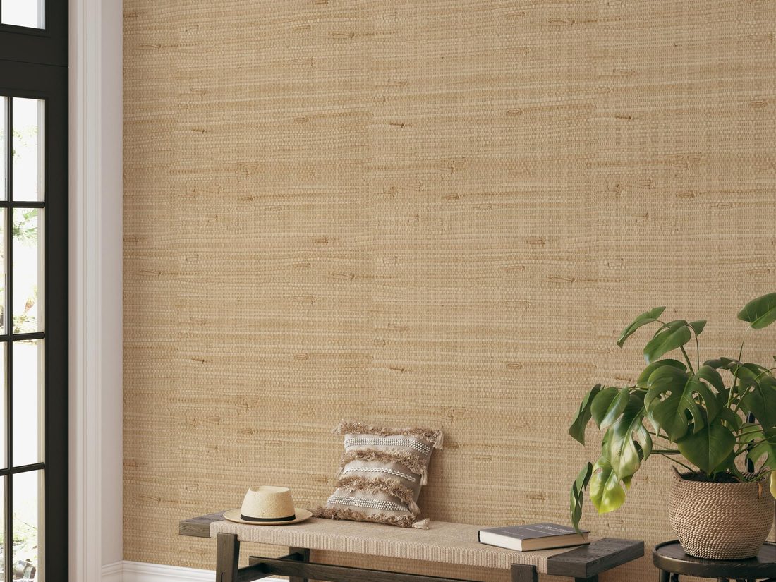 Close detail of natural grasscloth textured wallpaper on a finished wall